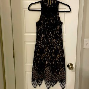 Cute beige and black fit and flare high neck dress